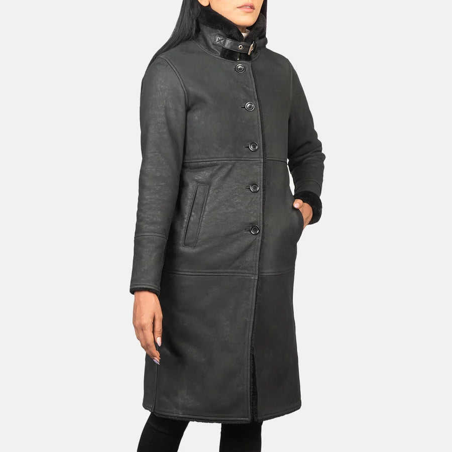 Women's Alina black distressed shearling coat with panel seams and fur trim cuffs, angled