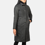 Women's Alina black distressed shearling coat with panel seams and fur trim cuffs, angled
