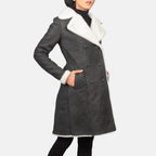 Women's Amie black distressed shearling coat with fitted waist and fur trim cuffs, angled