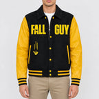 Men’s black wool varsity jacket with yellow leather sleeves, shirt collar, snap button front and striped rib hem