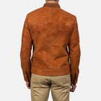 Back view of a man wearing a tan brown suede bomber jacket.