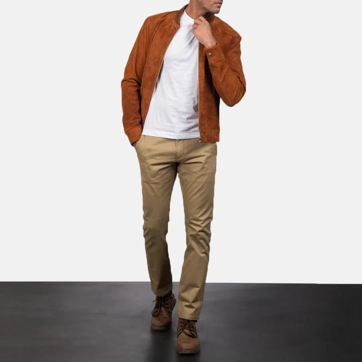 Full-body front view of a model wearing a brown suede leather jacket with beige trousers.