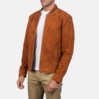 hree-quarter side profile view of a man wearing a tan suede bomber jacket.