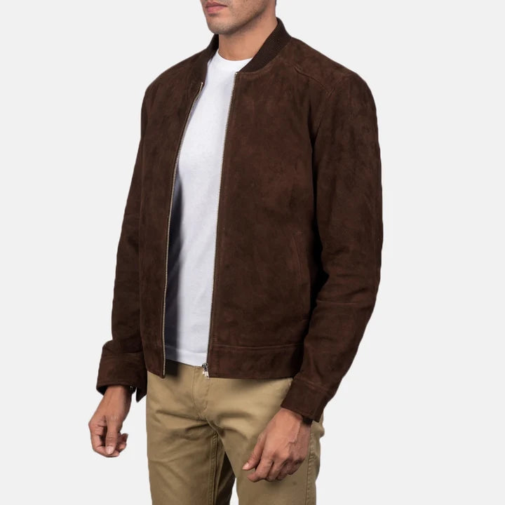 Three-quarter side angle shot of a man wearing a mocha brown suede bomber jacket.