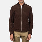 Full-length standing view of a model wearing a mocha brown suede jacket with khaki trousers.