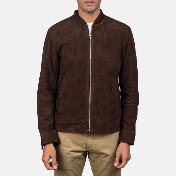 Full-length standing view of a model wearing a mocha brown suede jacket with khaki trousers.