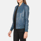 Women’s Bliss blue leather bomber jacket with fitted sleeve and rib knit cuffs, angled