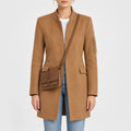 Women’s camel brown wool blend coat with stand collar, front zipper, flap pockets and sleeve zip pocket, front view