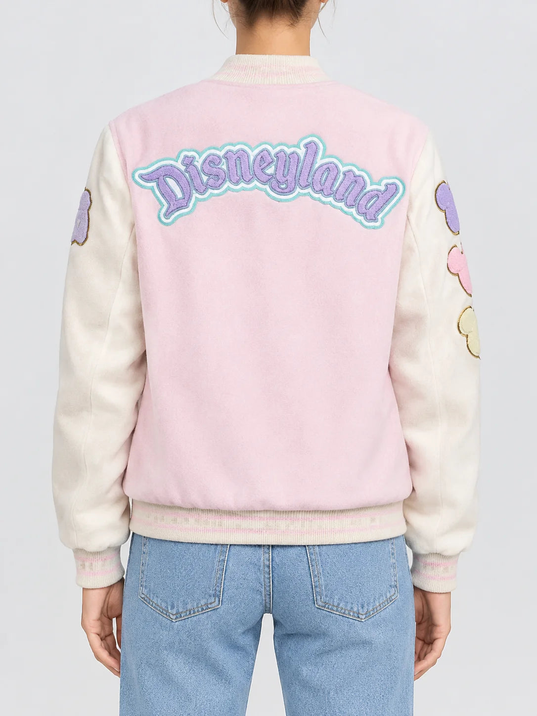 Women’s lavender blue wool varsity jacket with cream sleeves, chenille patches and snap button front