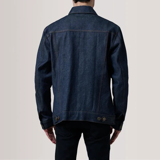 Close up view of sleeve cuff, buttons, and stitching on Conard Indigo Blue Denim Trucker Jacket