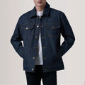 Front standing pose of male model wearing Conard Indigo Blue Denim Trucker Jacket