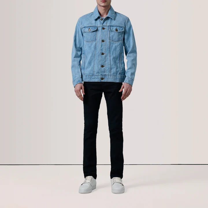 Model wearing Conard light blue denim trucker jacket with black jeans