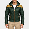 Men’s green hooded faux leather jacket with gold shoulder armor, chain clasp, buckle waist straps and front zipper