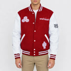 Men’s maroon wool varsity jacket with white leather sleeves, striped rib trim, snap front and embroidered patches