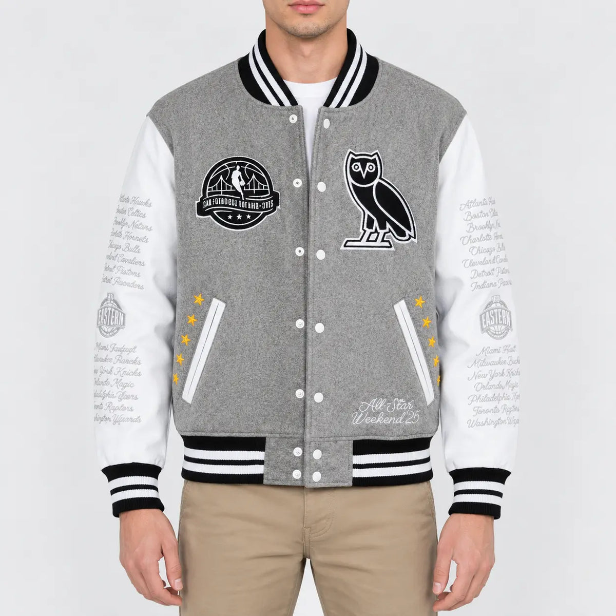 Men’s grey wool varsity jacket with white leather sleeves, striped rib trim, snap front and embroidered patches