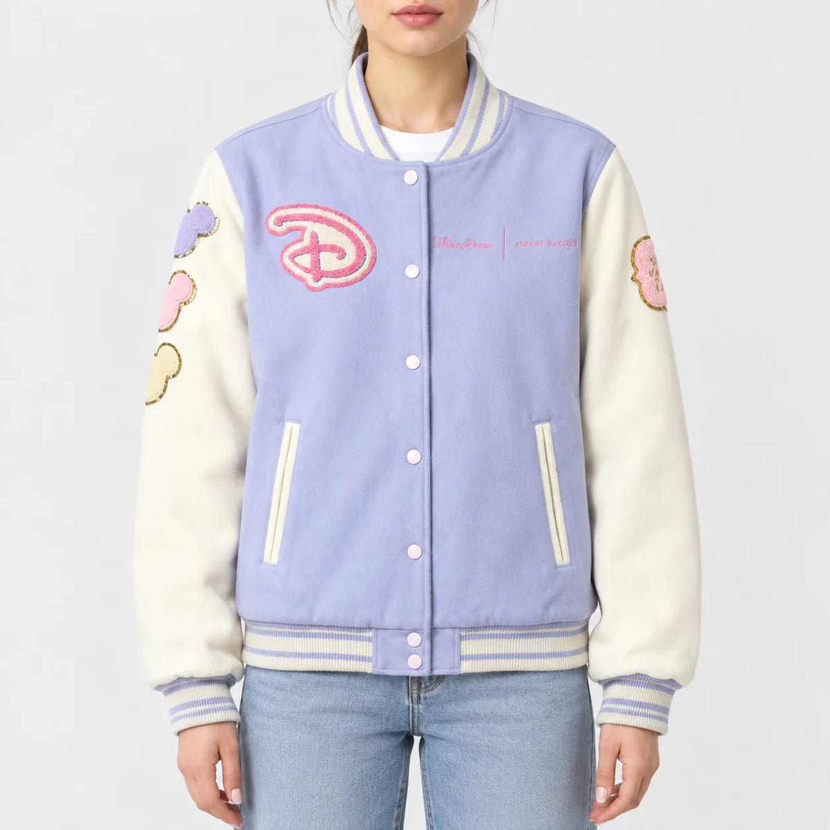 Women’s pink wool varsity jacket with cream sleeves and chenille lettering across the back