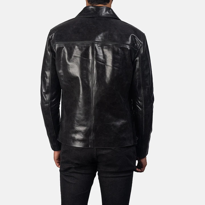 Mystical black leather jacket folded flat lay view