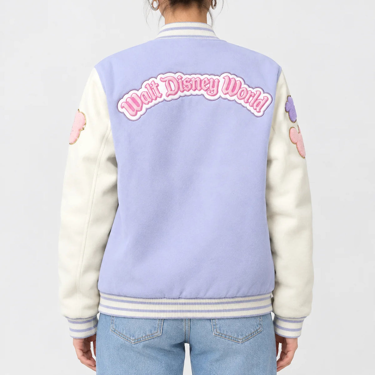 Women’s lavender blue wool varsity jacket with cream sleeves and chenille lettering across the back