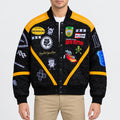 Men’s black twill racing bomber jacket with yellow panels, ribbed collar, snap-button front and embroidered patches
