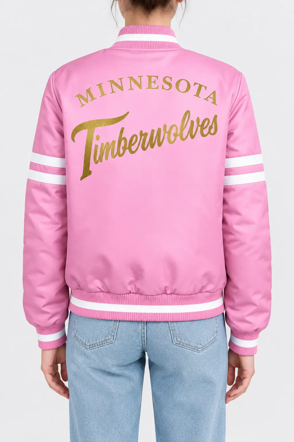 Women’s pink satin full-snap varsity jacket with gold script lettering across the back and white sleeve stripes