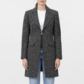 Women’s black and white tweed wool coat with notched lapel collar, front zipper, flap pockets and sleeve zip pocket