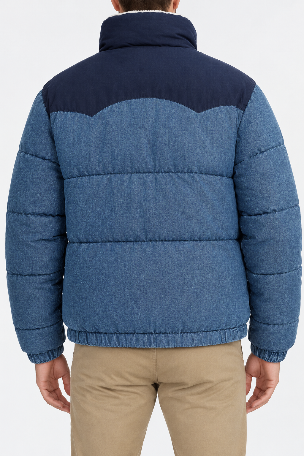 Men’s blue denim puffer jacket with navy contrast yoke, quilted back panels and elastic hem