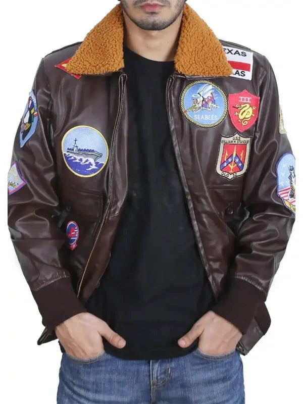 Men’s brown leather flight bomber jacket with faux shearling collar, front zipper, flap pockets and embroidered patches